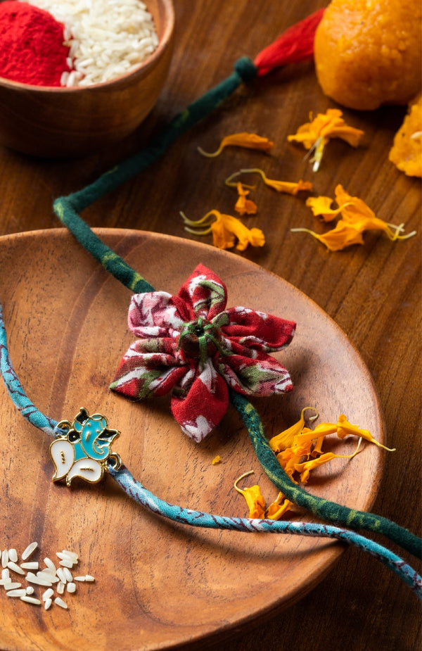 <strong>Sustainable Cloth Rakhi Combo<br>Ganesh + Phool</strong> <br><i>with Roli & Akshat</i> - Nat Habit